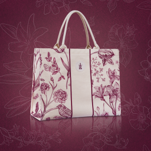 Sothys bag from the summer collection with a purple flower and butterfly print on a beige fabric